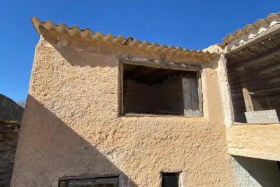Wood shed, house to be finished  and land in stunning location of Velez Blanco