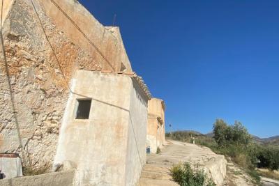 Wood shed, house to be finished  and land in stunning location of Velez Blanco