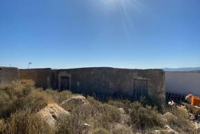 Wood shed, house to be finished  and land in stunning location of Velez Blanco